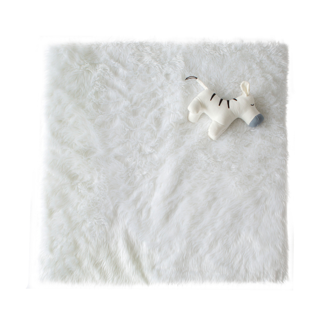 Cattywampus white fluffy faux fur playmat with grey cotton jersey 
