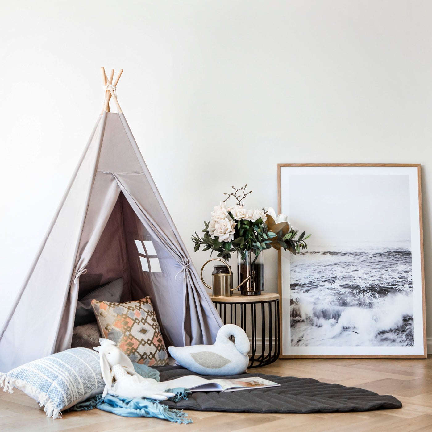 Cattywampus Wild Dove kids teepee tent in grey colour styled in home for a kids play space