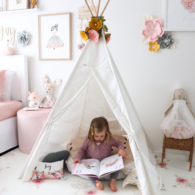 Little girl playing in her Cattywampus Snow Dust kids teepee tent